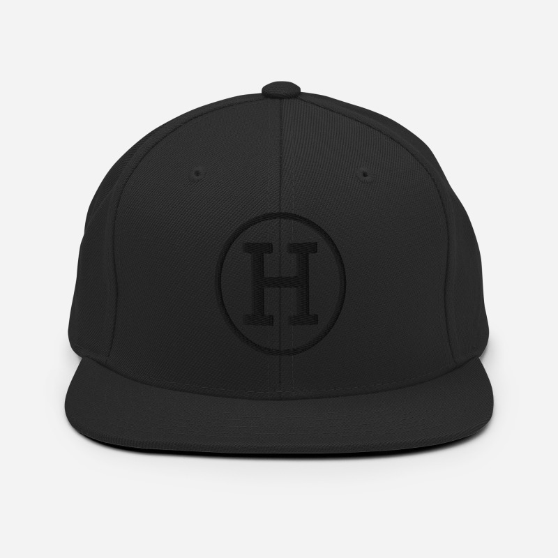 A black snapback hat with the logo for certified-haters.com embroidered on the front of the hat.