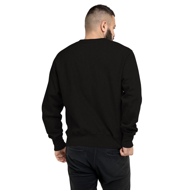 A rear view of a young man wearing a black champion sweatshirt.