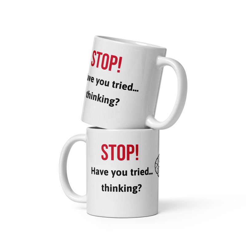 Two funny white mugs stacked on top of each other that say "Stop! Have you tried thinking?" written on their sides.